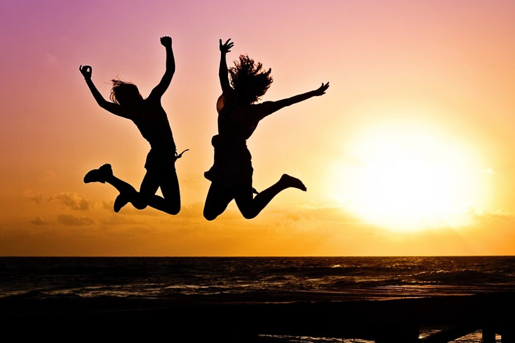 Benefits of being happy - happy people jumping